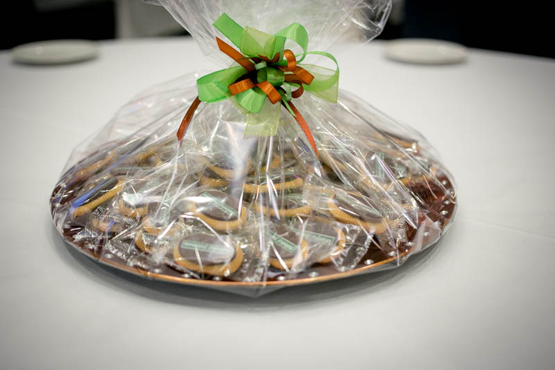 Anniversary Gifts - 350g Plastic plate filled with 50 pcs of 5 g biscuits topped with branded chocolate bar